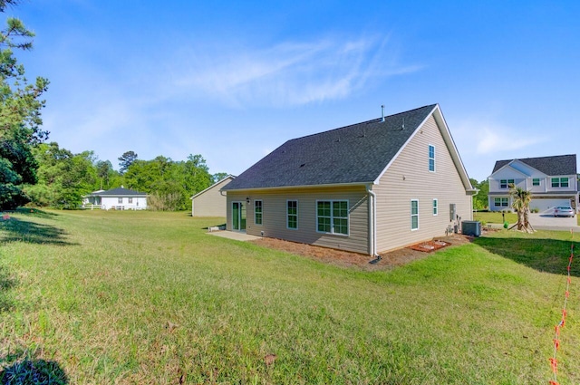 224 Young Town Cir, Orangeburg, SC 29118 - rear view of house with central air condition unit, a yard, and a shingled roof