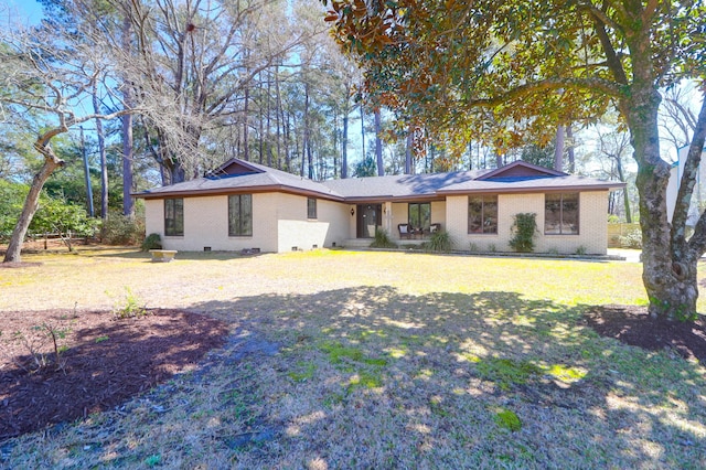 single story home with crawl space, brick siding, and a front yard