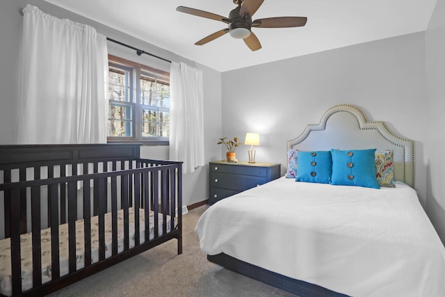 bedroom with baseboards, a ceiling fan, and carpet flooring