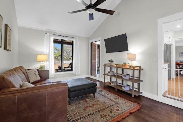 living room with ceiling fan, baseboards, high vaulted ceiling, and wood finished floors