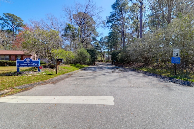 view of road featuring curbs