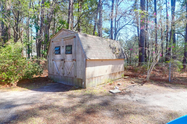 view of shed with fence