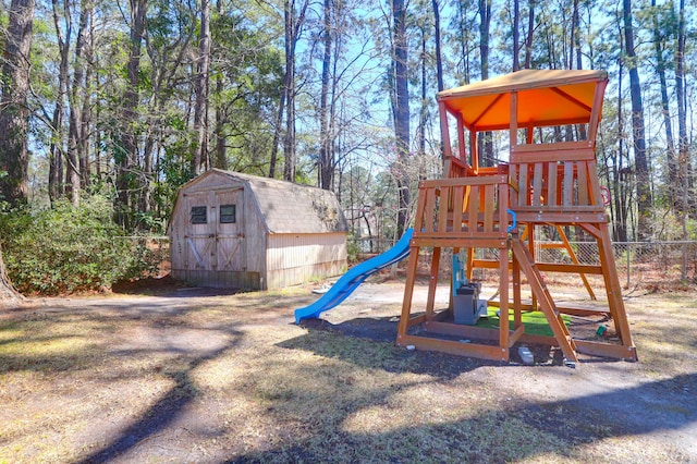 view of jungle gym featuring a shed and an outdoor structure