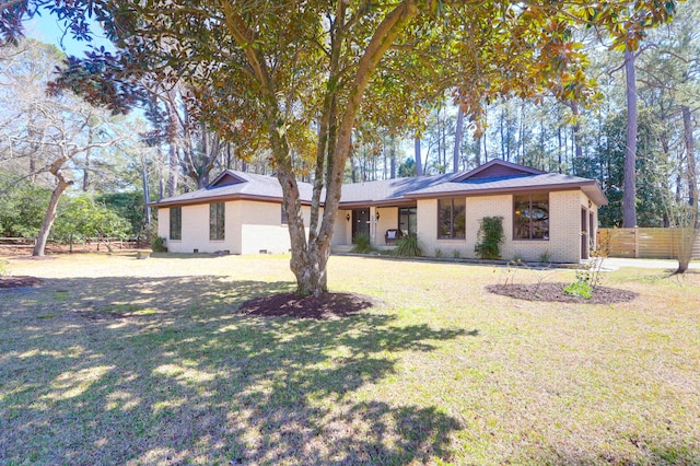 single story home featuring a front lawn, fence, brick siding, and crawl space