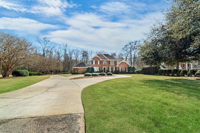 view of home's community featuring a lawn