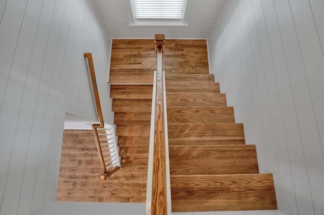 staircase with wooden walls