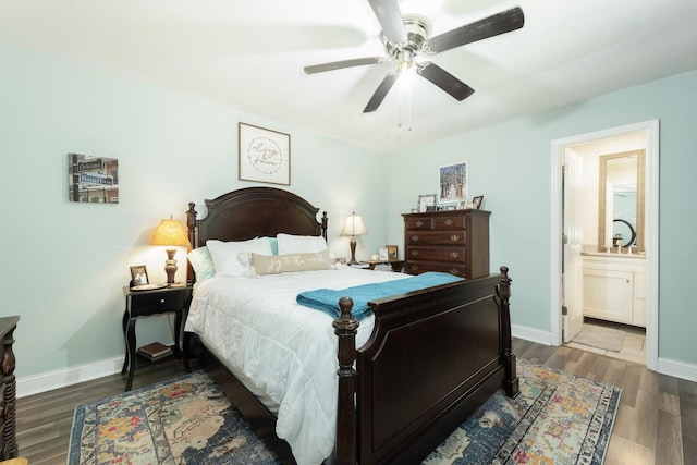 bedroom with ceiling fan, ensuite bathroom, and dark hardwood / wood-style floors