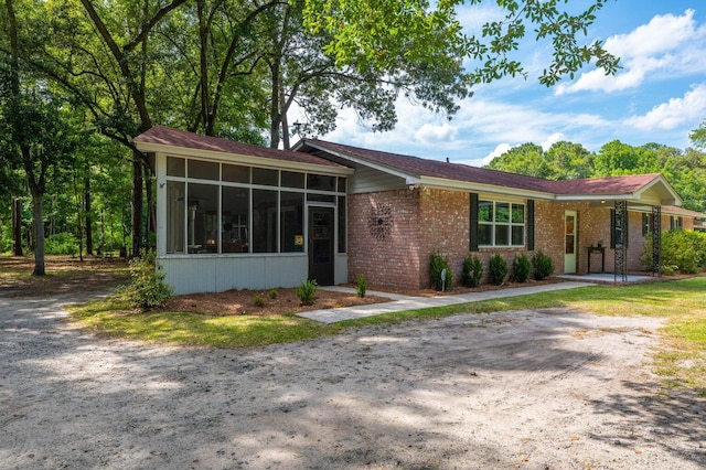 view of front of property with a sunroom