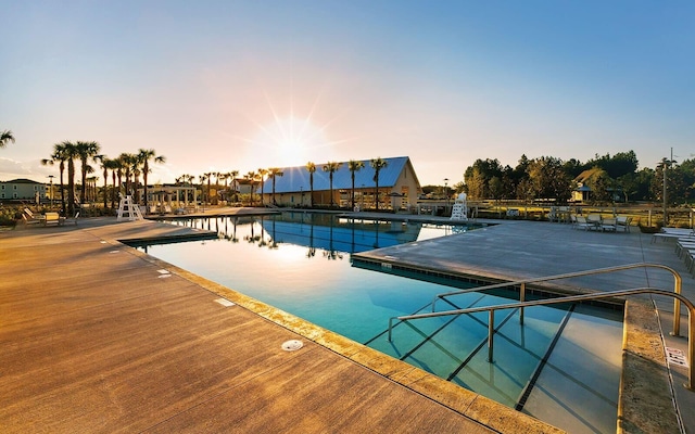 pool at dusk with a boat dock