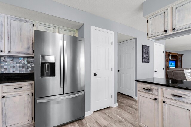 100 Conset Bay Ct, Goose Creek, SC 29445 - kitchen with stainless steel refrigerator with ice dispenser, light wood-style flooring, baseboards, and tasteful backsplash