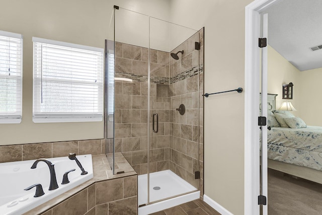 100 Conset Bay Ct, Goose Creek, SC 29445 - bathroom featuring ensuite bath, a garden tub, a shower stall, and healthy amount of natural light