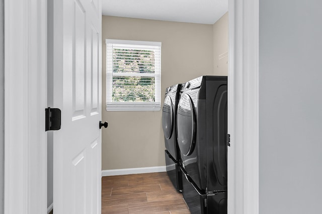 100 Conset Bay Ct, Goose Creek, SC 29445 - laundry room with washer and dryer, wood finished floors, and baseboards