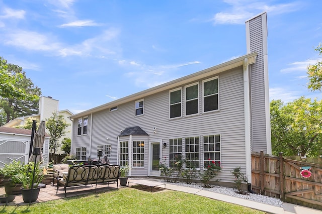 100 Conset Bay Ct, Goose Creek, SC 29445 - rear view of house with a patio area, an outdoor hangout area, and a chimney