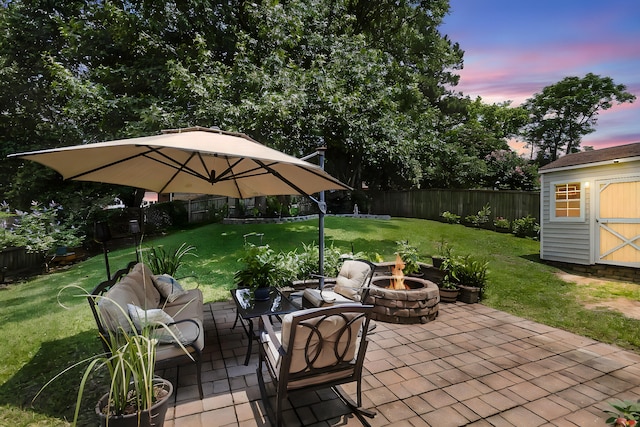 100 Conset Bay Ct, Goose Creek, SC 29445 - patio terrace at dusk featuring an outdoor fire pit and a patio area