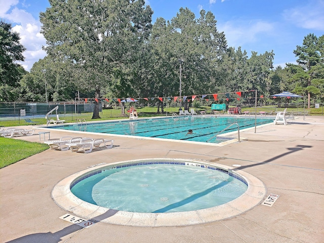 100 Conset Bay Ct, Goose Creek, SC 29445 - community pool featuring a patio and view of wooded area