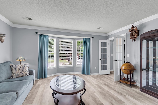 100 Conset Bay Ct, Goose Creek, SC 29445 - living area featuring light wood-style floors, french doors, a textured ceiling, crown molding, and baseboards