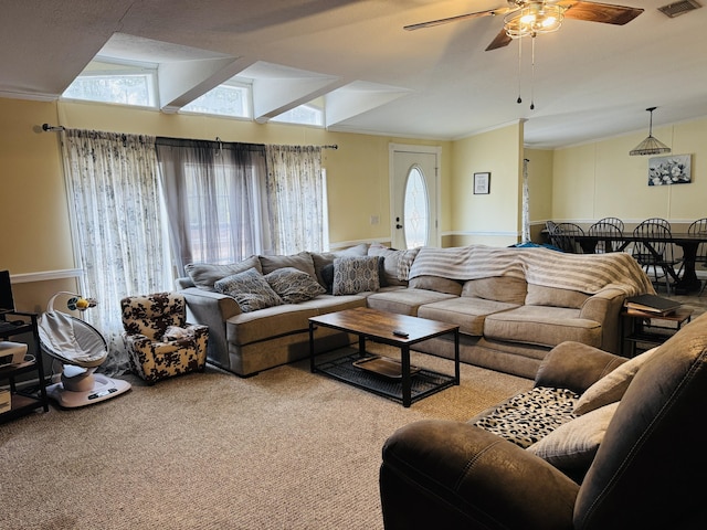 carpeted living room with vaulted ceiling and ceiling fan