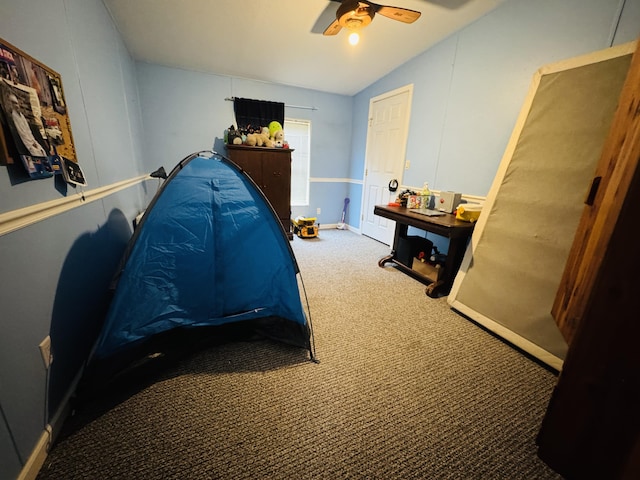 carpeted bedroom featuring ceiling fan and lofted ceiling