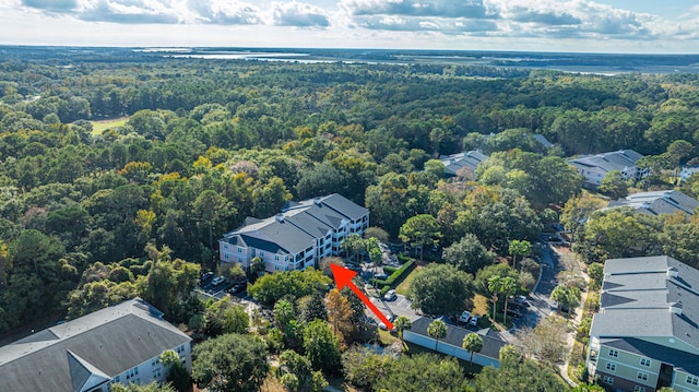 aerial view of residential area with a heavily wooded area