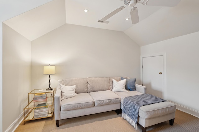 carpeted living room featuring ceiling fan and vaulted ceiling