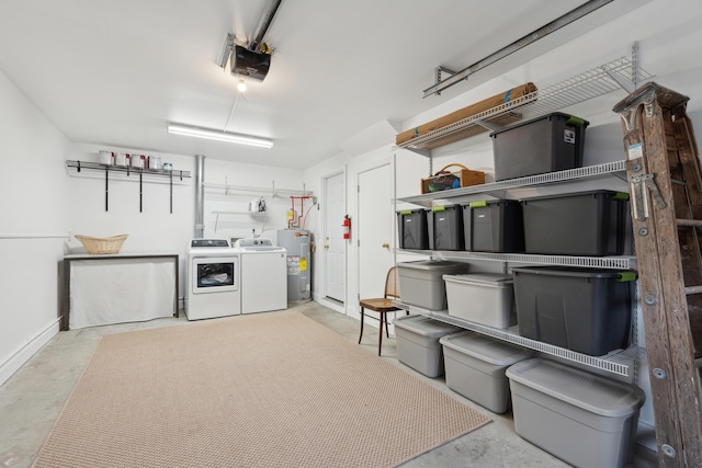 basement featuring independent washer and dryer and electric water heater