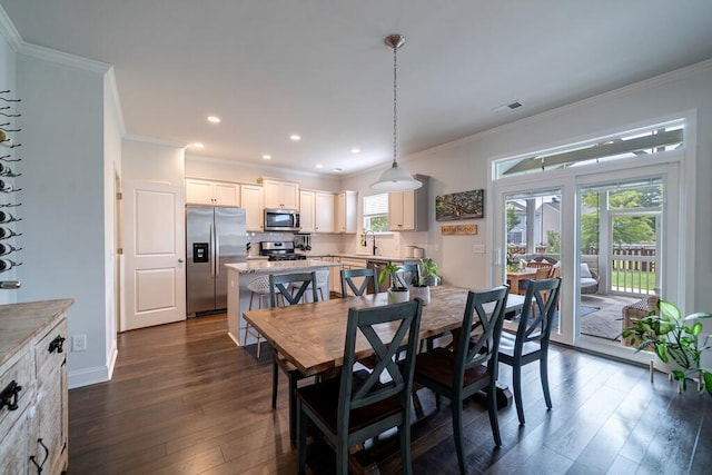 2024 Lanneau Ln, Johns Island, SC 29455 - dining space featuring dark wood-style floors, crown molding, and recessed lighting