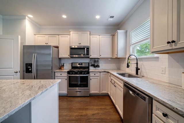 2024 Lanneau Ln, Johns Island, SC 29455 - kitchen with stainless steel appliances, ornamental molding, light stone countertops, dark wood-style flooring, and decorative backsplash