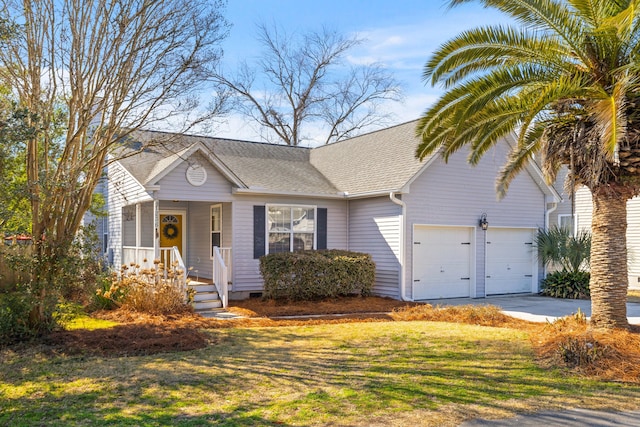 view of front of house featuring roof with shingles, a porch, concrete driveway, an attached garage, and a front yard