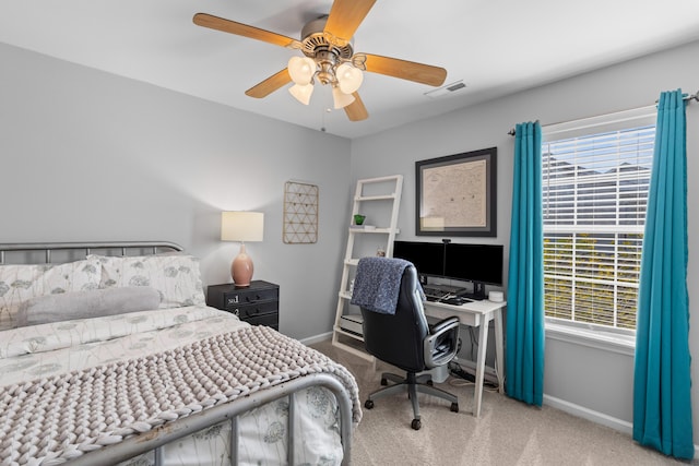 bedroom featuring multiple windows, visible vents, and carpet flooring