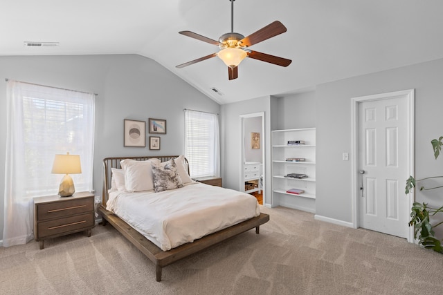 bedroom with light carpet, lofted ceiling, visible vents, and baseboards