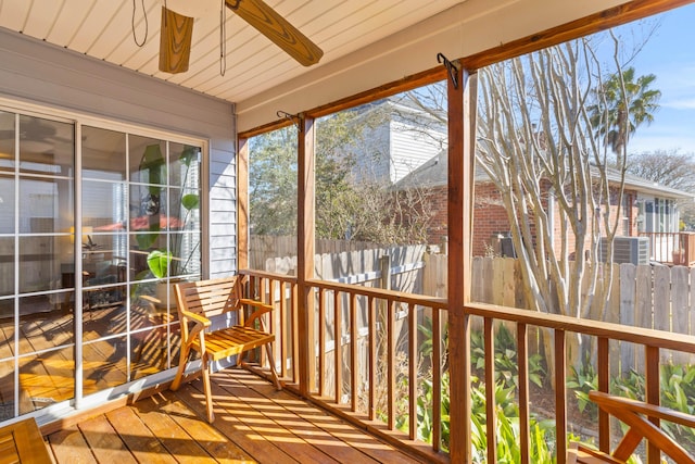 sunroom featuring a ceiling fan