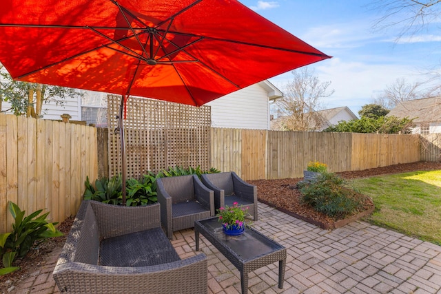 view of patio / terrace with a fenced backyard and outdoor lounge area