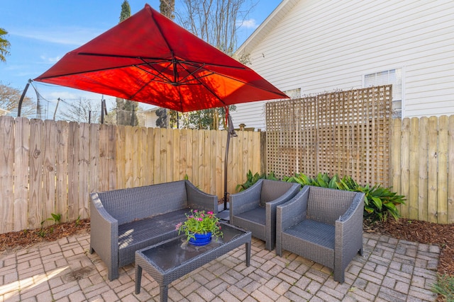 view of patio / terrace with a fenced backyard and an outdoor hangout area