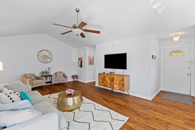 living room featuring lofted ceiling, baseboards, a ceiling fan, and wood finished floors