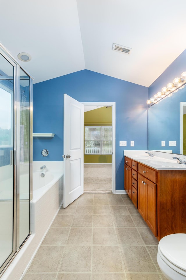 full bathroom featuring shower with separate bathtub, lofted ceiling, vanity, toilet, and tile patterned floors