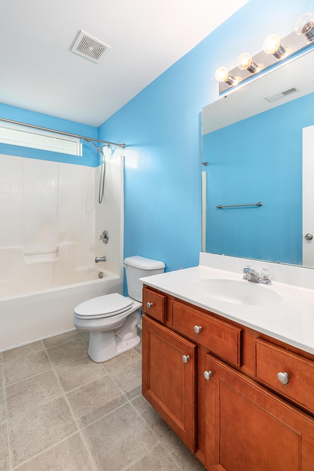 full bathroom featuring tile patterned flooring, vanity, shower / bathtub combination, and toilet