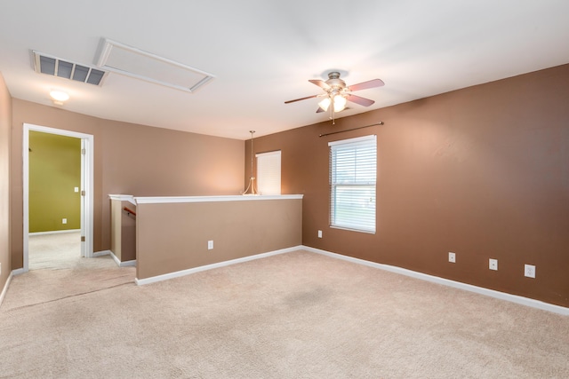 empty room with light carpet and ceiling fan