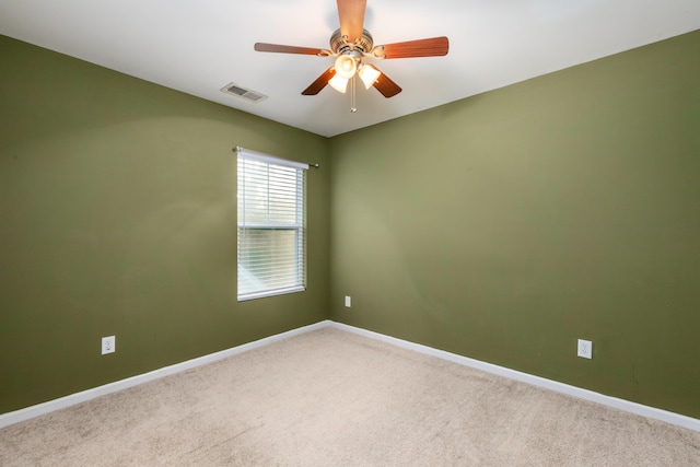 empty room with carpet and ceiling fan