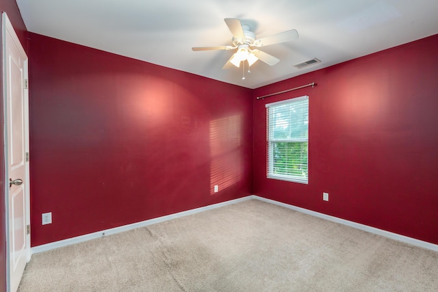 carpeted empty room with ceiling fan