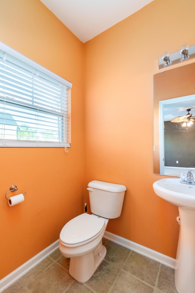 bathroom featuring tile patterned floors and toilet