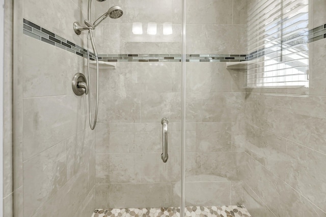 bathroom with a shower stall