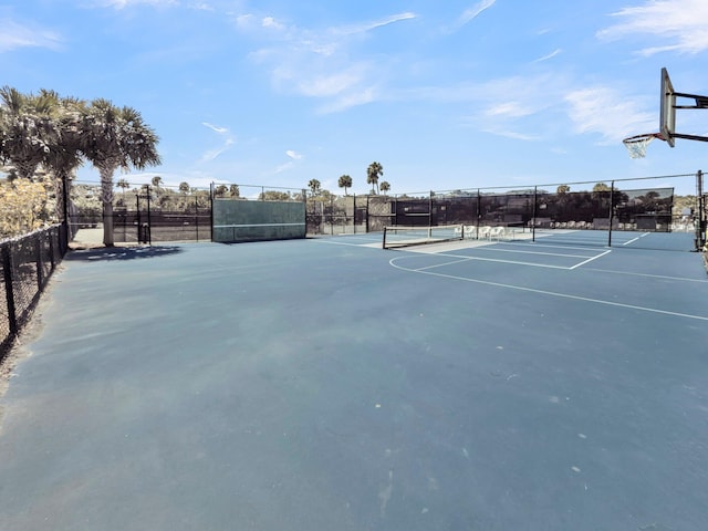 view of sport court with fence