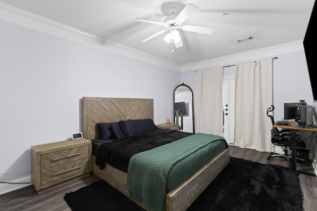 bedroom with ceiling fan, dark hardwood / wood-style floors, and crown molding