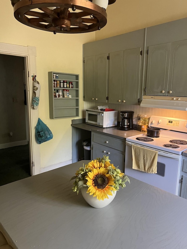 kitchen with ventilation hood, white appliances, and tasteful backsplash