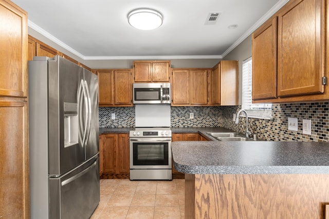 kitchen with visible vents, appliances with stainless steel finishes, crown molding, a sink, and light tile patterned flooring