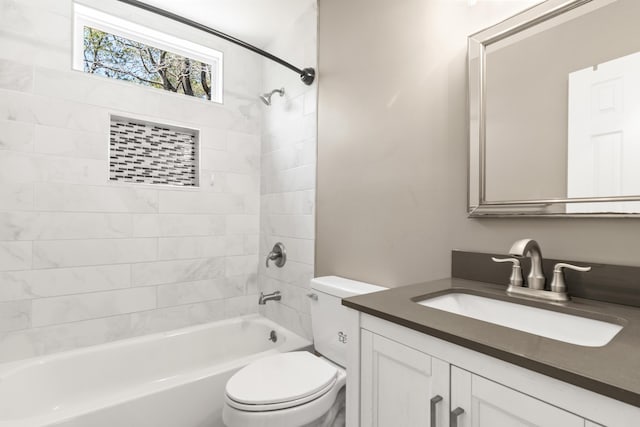 full bathroom with shower / washtub combination, vanity, and toilet