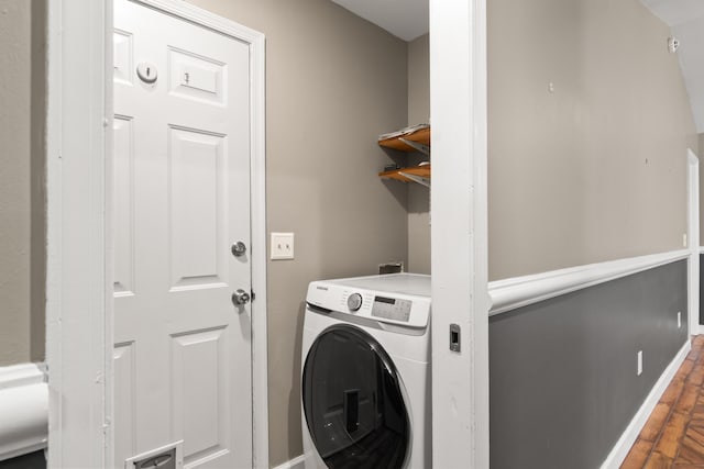 laundry area featuring visible vents, wood finished floors, washer / dryer, laundry area, and baseboards