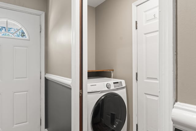 laundry room featuring washer / dryer and laundry area