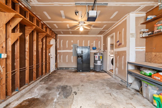 garage with water heater, a garage door opener, black refrigerator with ice dispenser, electric panel, and washer / clothes dryer