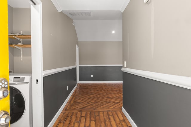 hall with baseboards, visible vents, washer / clothes dryer, and wood finished floors